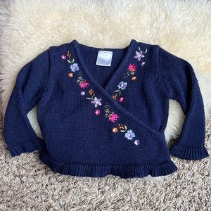 Blue knit embroidered cross front sweater ruffle bottom and wrists 12m